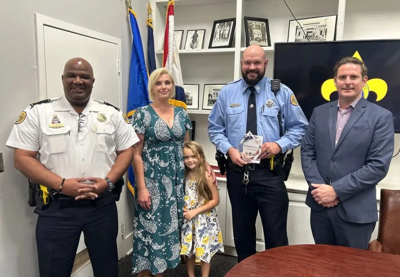 group photo with the officer of the month